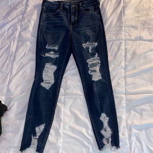 Distressed dark wash jeans